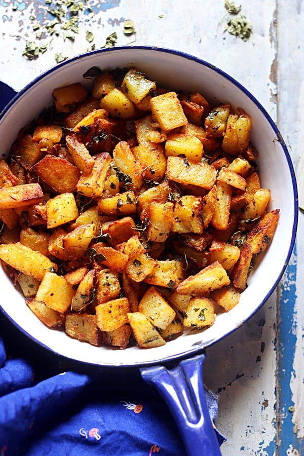 Potato roast served in a blue enamel pan- ready to eat