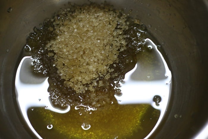 Combining oil and sugar in a bowl