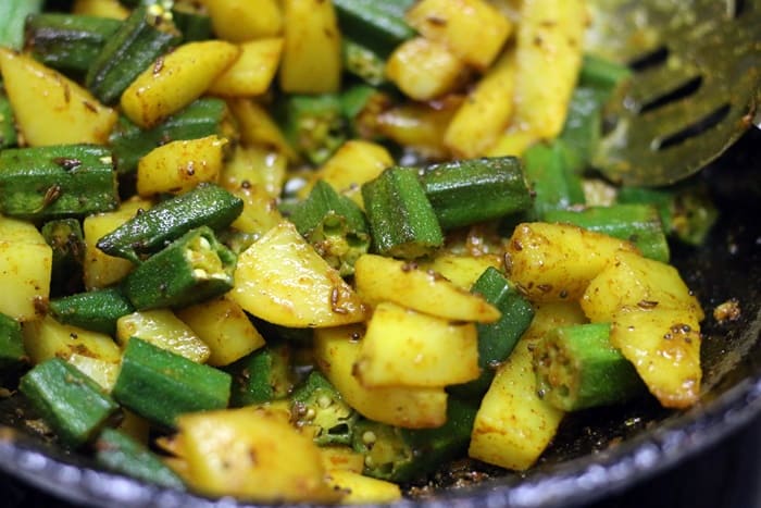 Making bhindi aloo recipe