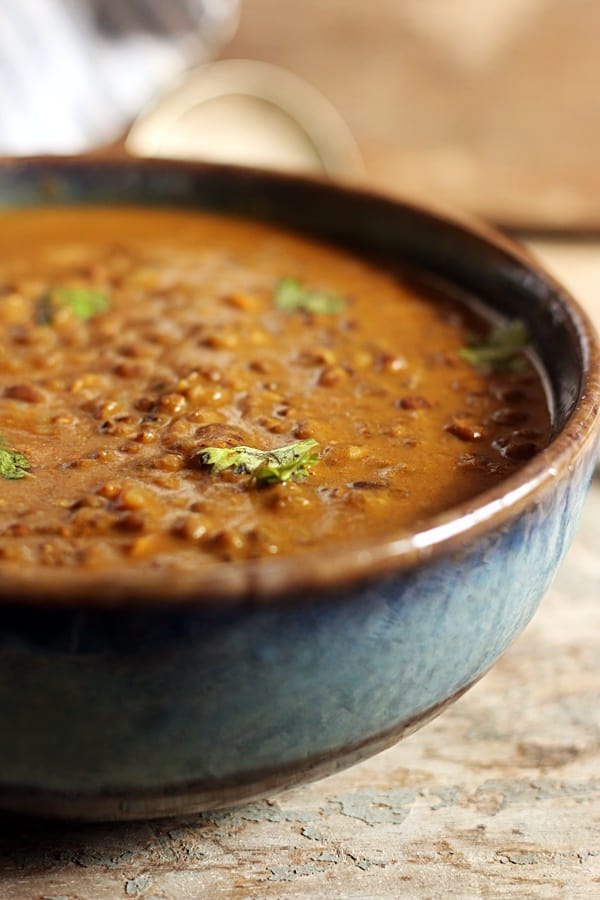 Creamy and delicious kali dal served in a ceramic bowl