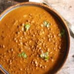 Closeup shot of creamy maa ki dal or kali dal served in a ceramic bowl for dinner