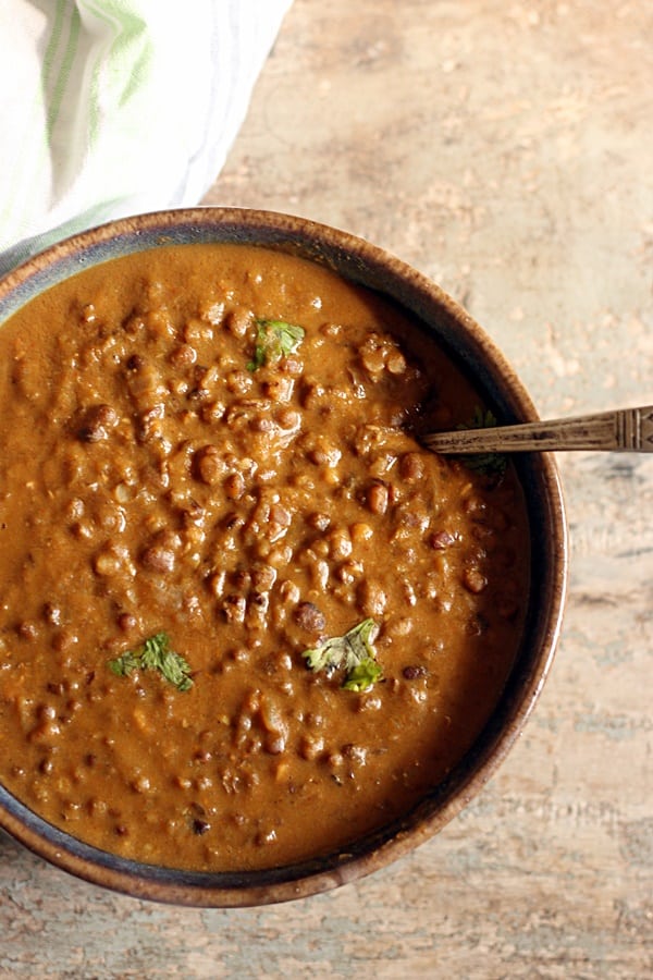 overhead shot of easy maa ki dal served in a blue ceramic bowl