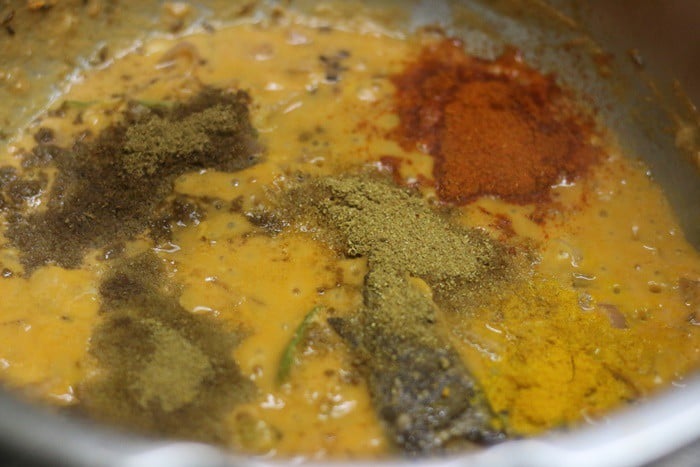 Adding spice powder for making kali dal recipe