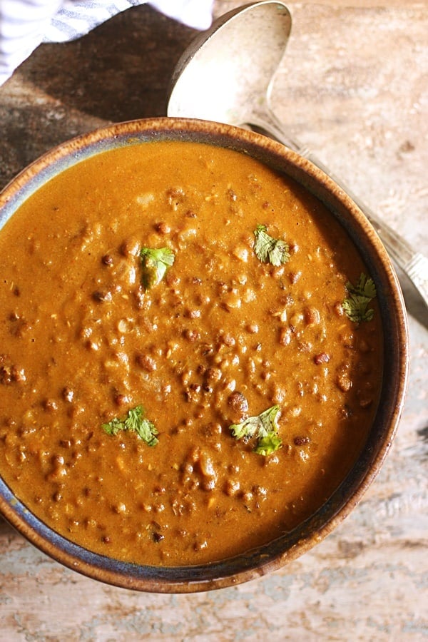 Closeup shot of creamy maa ki dal served in a ceramic bowl for dinner