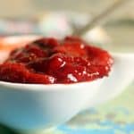 Fresh homemade strawberry sauce in a white sauce bowl