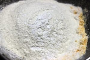 sifting dry ingredients for making custard creams