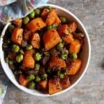 overhead shot of delicious Indiangajar matar sabzi- carrot and green peas stir fry served for lunch