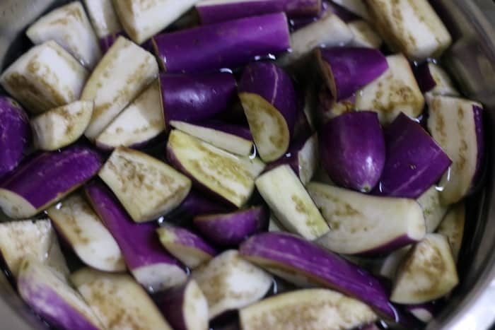 Eggplants in salted water for making brinjal fry recipe