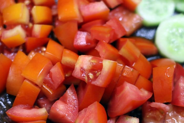 Chopped tomatoes for making cucumber tomato salad