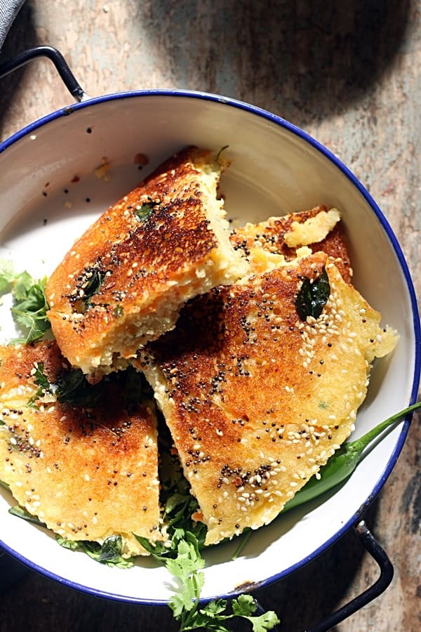 Handvo slices served in a pan for snack