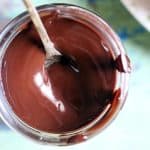 closeup shot of homemade chocolate syrup served with a spoon