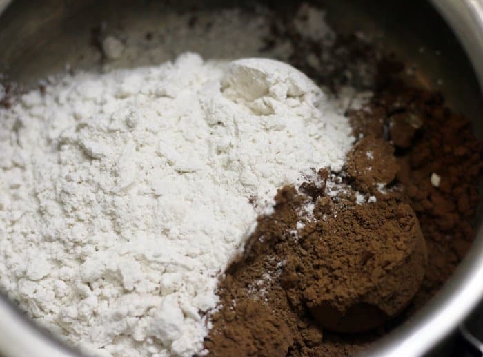 Corn flour, powdered sugar and cocoa powder measured in a sauce pan for making chocolate syrup