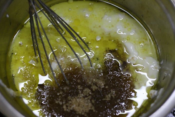 Oil, curd, sugar and vanilla combined in a bowl