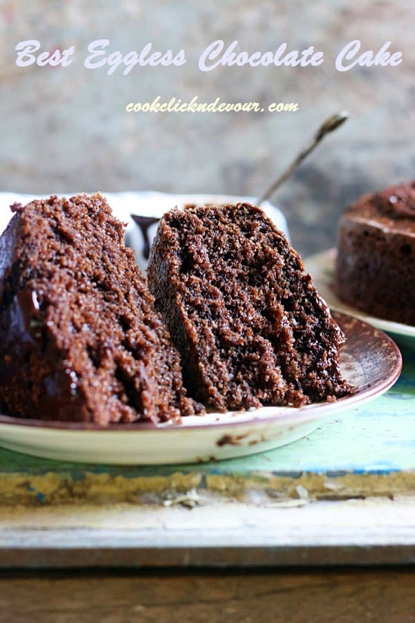 Two slices of egg free chocolate cake served on a white plate