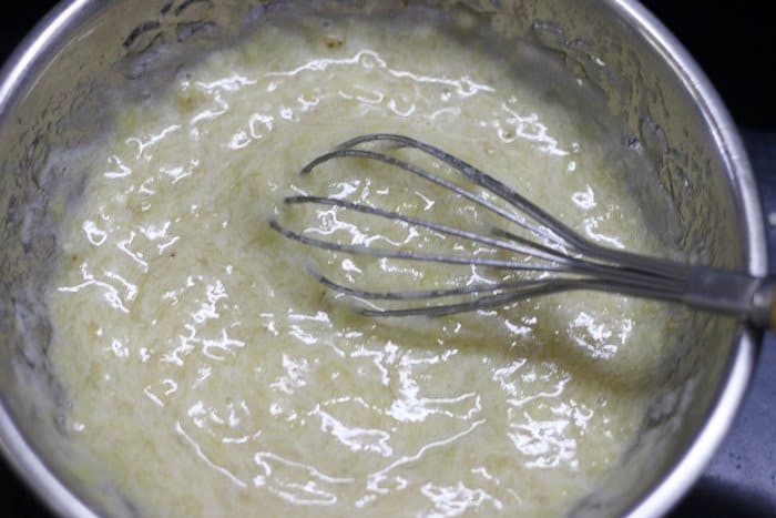 Overripe bananas mashed in a bowl
