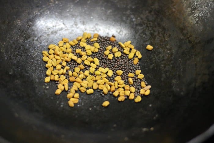 dry roasting fenugreek and ethi seeds for instant mango pickle