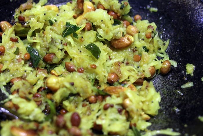 Making raw mango rice