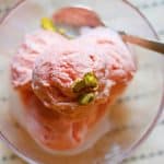 Homemade watermelon ice cream served in dessert bowl with a spoon