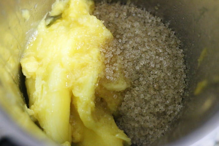 mangoes and sugar in a blender jar