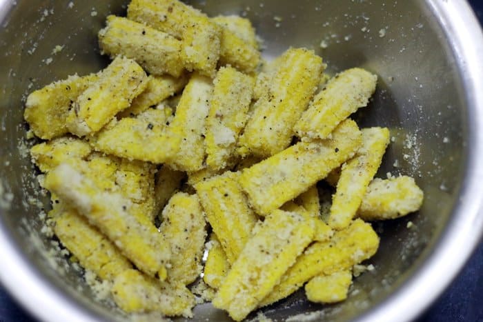 Flour coated baby corns ready to fry