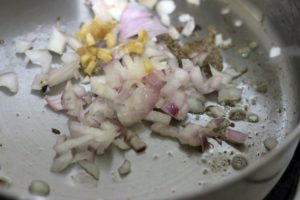 frying onion ginger garlic in oil