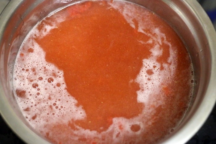 making strawberry agua fresca