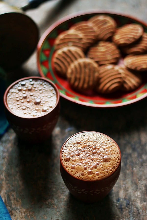 Tandoori chai served in kulhad with biscuits