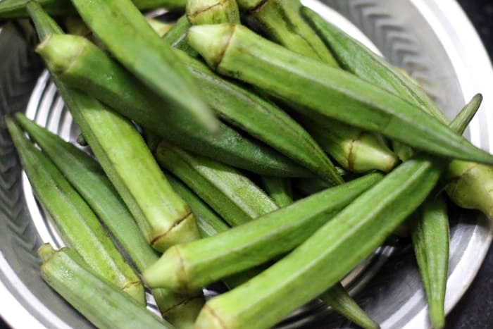 Bharwa bhindi is a popular Indian okra fry with a flavorful dry spice stuffing. Bharwa means stuffed and bhindi means okra in Hindi. This is a vegan gluten free stuffed okra fry that tastes so good with rice or roti. Here is how to make bharwa bhindi easily at home. rinsed and dried okra for bharwa bhindi