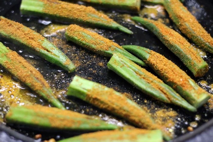 Bharwa bhindi is a popular Indian okra fry with a flavorful dry spice stuffing. Bharwa means stuffed and bhindi means okra in Hindi. This is a vegan gluten free stuffed okra fry that tastes so good with rice or roti. Here is how to make bharwa bhindi easily at home. making bharwa bhindi