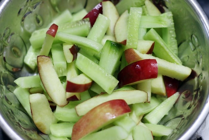 making apple and cucumber salad