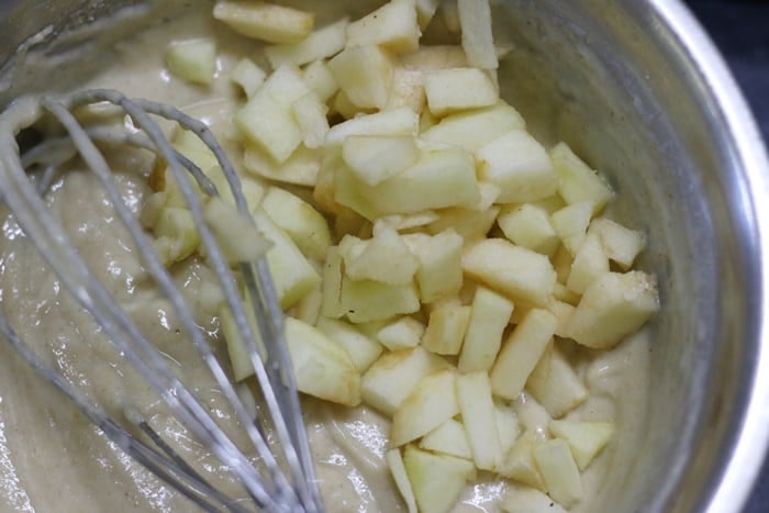 apple pieces folded into batter