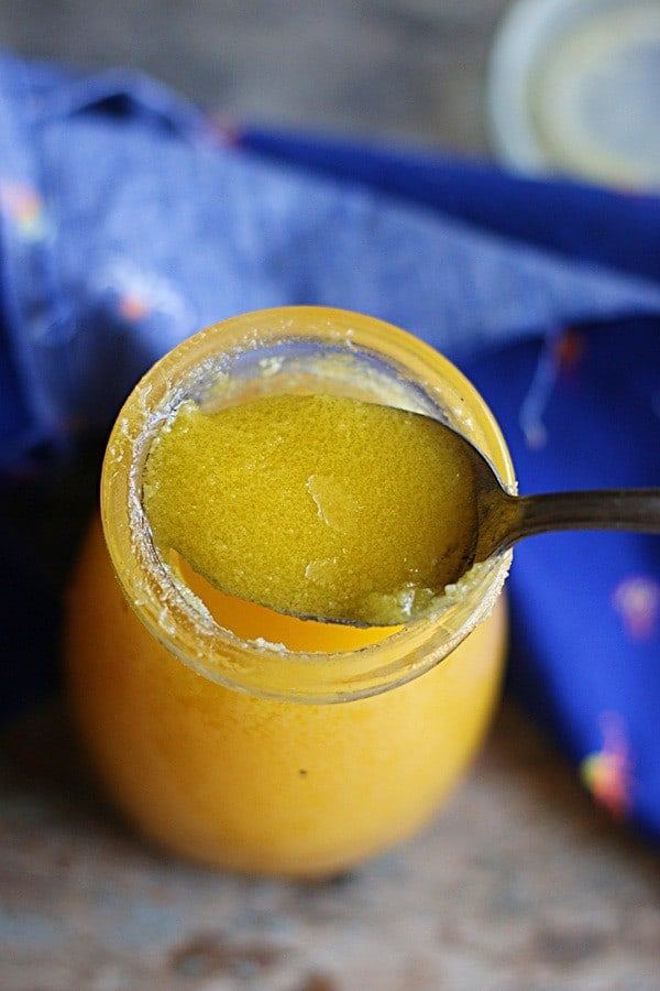 closeup shot of homemade ghee in a spoon