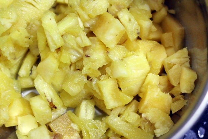 Chopped pineapples added to oil