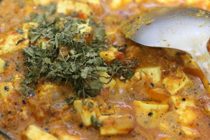 kasuri methi added to achari paneer gravy.