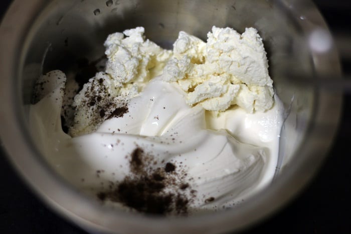 cream cheese, fresh cream and vanilla in a bowl for whipping