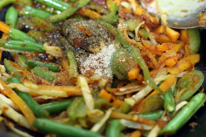 Soy sauce, salt and pepper added to stir fried vegetables