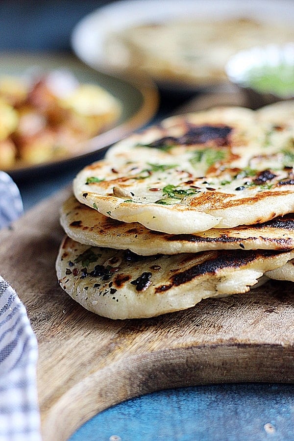 closeup shot of soft fluffy vegan naan breads stacked