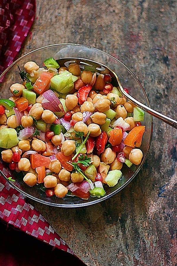 Chickpea salad served with a spoon