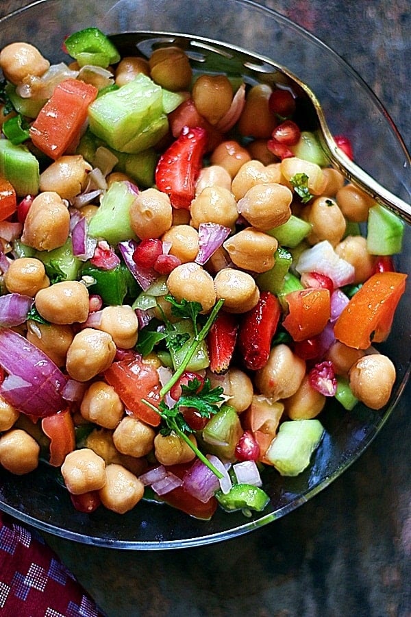 Crispy and fresh homemade vegan chickpea salad served in a glass bowl.