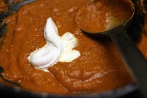 cream added to tomato gravy