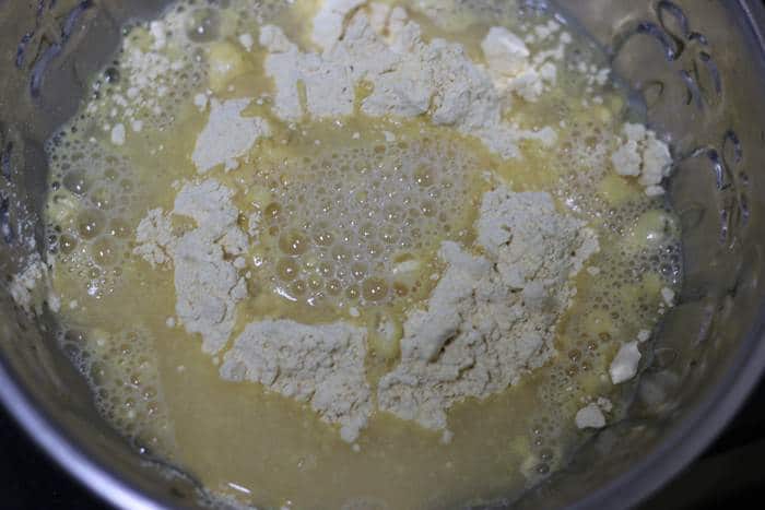 water and chickpea flour in a bowl