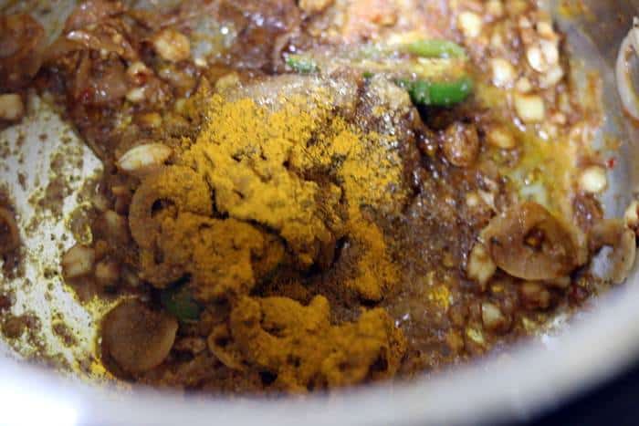 spice powders added to curry paste