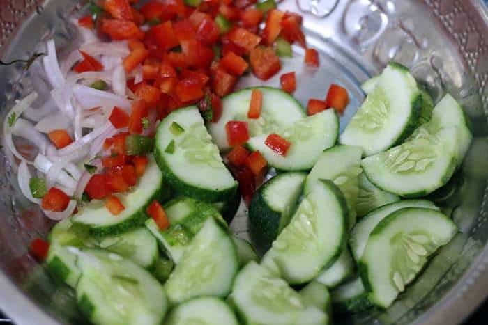 Sliced cucumbers, onions and chopped red bell peppers