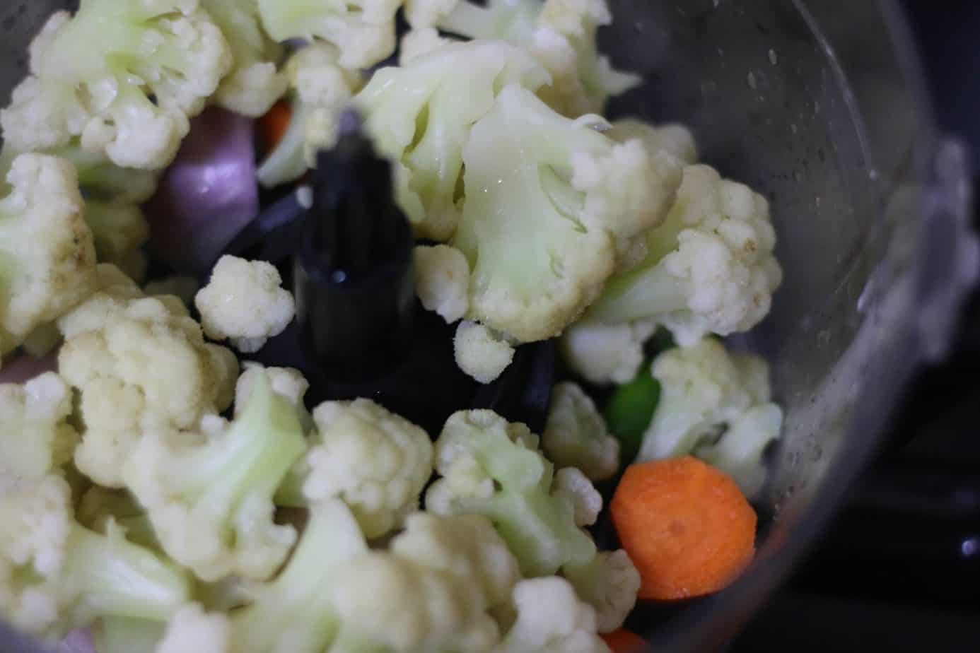 cauliflower florets added to food processor jar