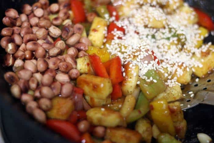 peanuts and sesame seeds added to kung pao tofu