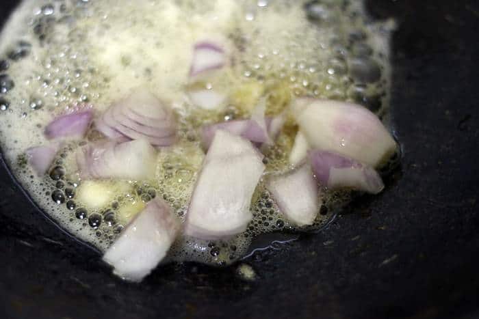 frying onion in sesame oil for kung pao tofu