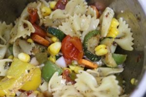 preparing vegan pasta salad