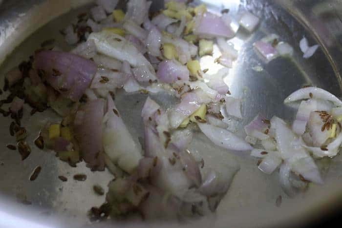 sauteing onions, ginger, cumin in oil