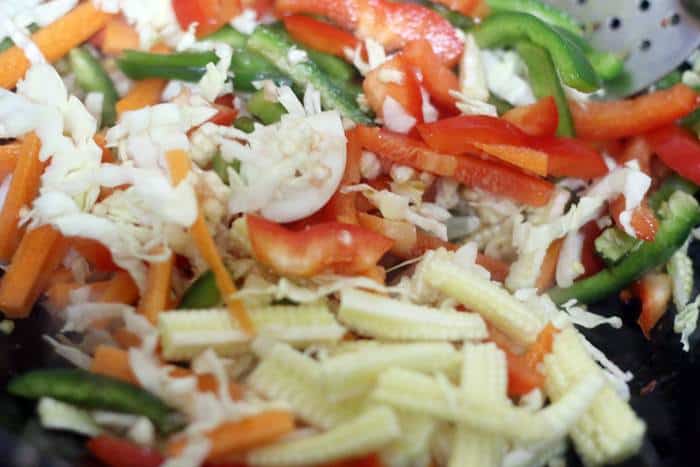 sauteing sliced vegetables in sesame oil