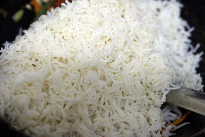 cooked rice added to vegetables